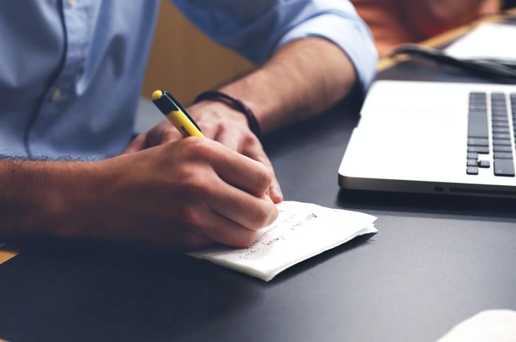 man checking journal