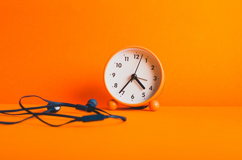 clock on orange background