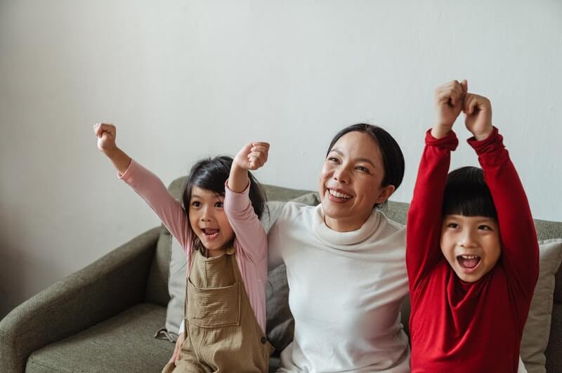 excited kids with mom